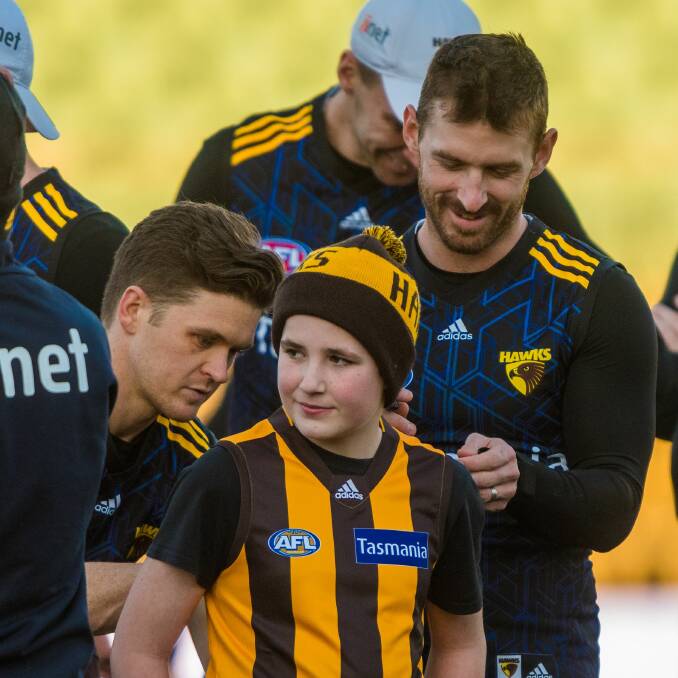 SUPERFAN: Hawthorn fan Luca Pryke helping out the team at Friday's Hawks training session. Picture: Phillip Biggs