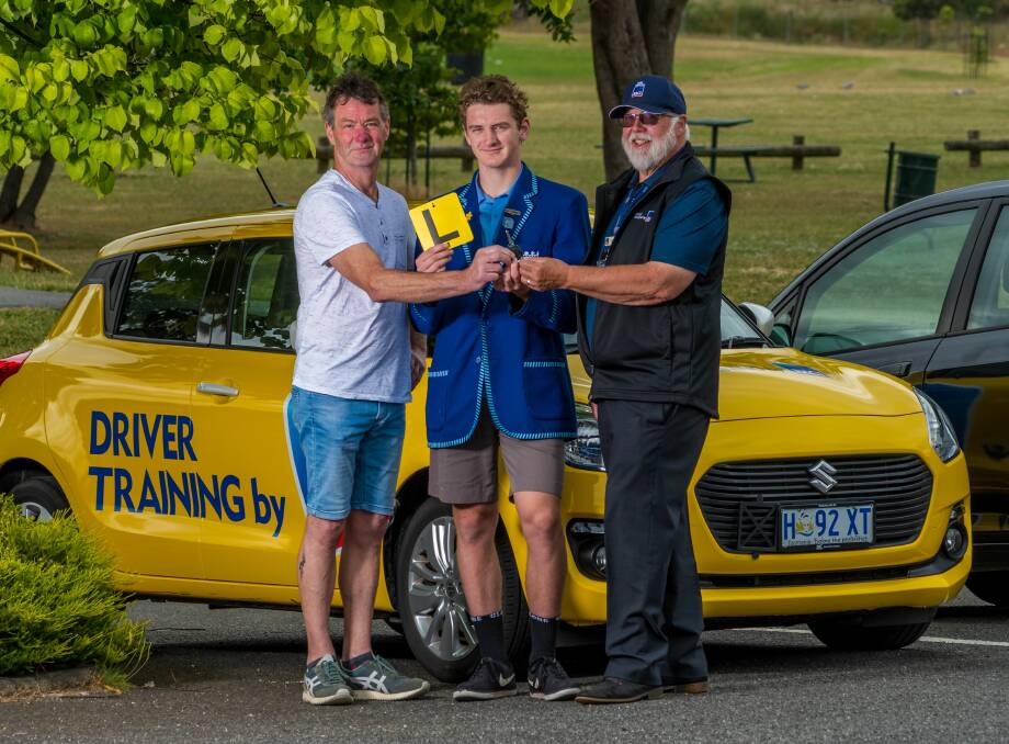 LEARNING: Rod Page with son and Kings Meadows High School student Kaiden Page, with RACT Launceston driving instructor Trevor Lewis. Picture: Phillip Biggs