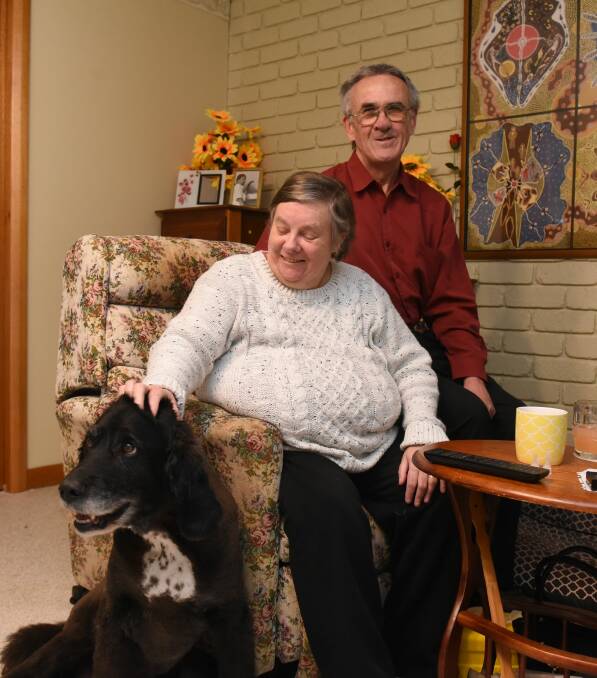 WORKING AS A TEAM: David and Carol Morrell at their Prospect home with their dog, Dala. Picture: Paul Scambler