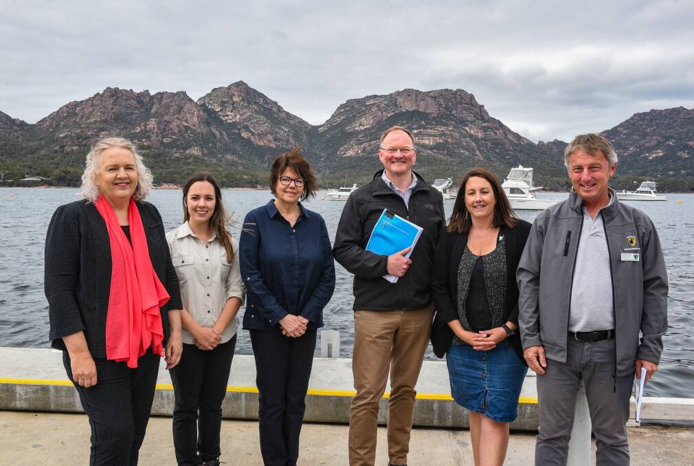 COMING TOGETHER: Mayor Debbie Wisby, PWS' Laura Spikula, TasWater's Juliet Mercer, Environment and Parks Minister Roger Jaensch, Freycinet Assocaition's Susan Carins, and PWS' Andrew Roberts. Picture: Paul Scambler