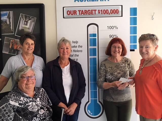 HARD WORK: St Helens District Hospital's Denise Callister, St Helens Hospital Auxiliary president Marg Osborne, treasurer Lyn Nichols, Ruth Bishop of the St Helens Market, and auziliary secretary Christine Treloggen with their fundraising thermometer. Picture: supplied