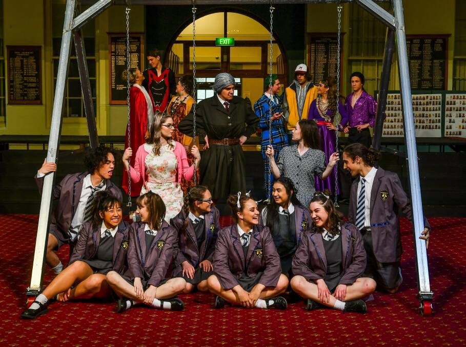 CURIOUS: The Launceston College cast of Matilda, with Elise Kolka as Miss Honey, Lachlan Hindrum as Miss Trunchbull, and Lauren Colson as Matilda. Picture: Scott Gelston