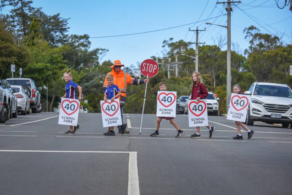 Crossing guard Greg Breaden with Aya Cottam, 10, Mylo Cottam 8, Edward Atwell, 6, Georgia Atwell, 10, and Nikaylah Peachey, 7, of Punchbowl Primary School. Picture: Paul Scambler