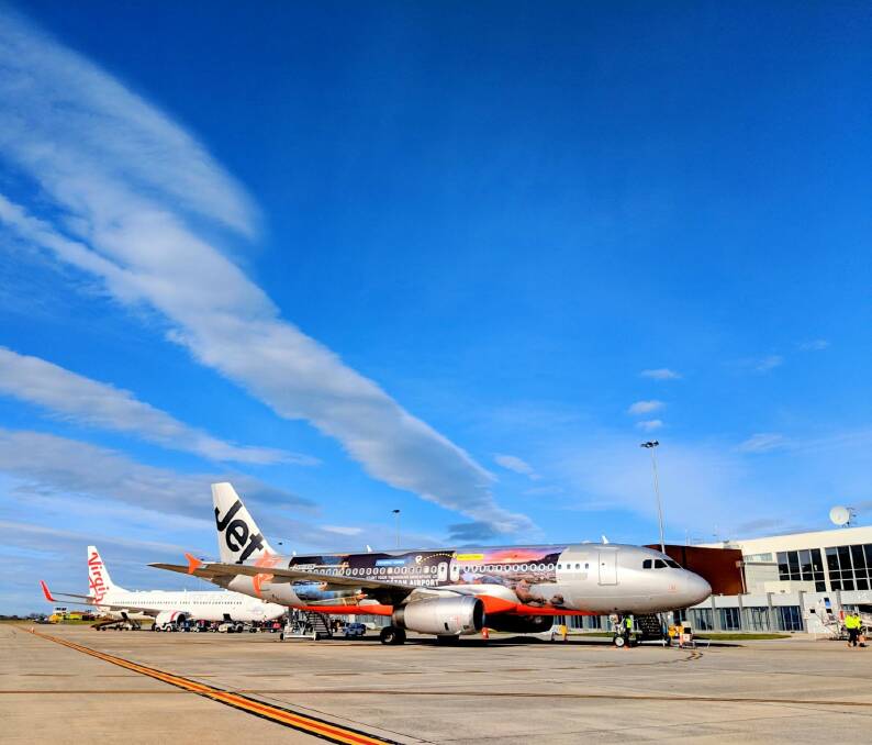 NATURAL WONDERS: The wrapped Jetstar Airbus A320 showcases Wineglass Bay, the Cataract Gorge, Bay of Fires, and Cradle Mountain. Picture: Martin Eadie