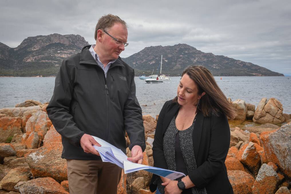 SOLUTION: Environment and Parks Minister Roger Jaensch with Freycinet Association president Susan Carins at Coles Bay. Picture: Paul Scambler