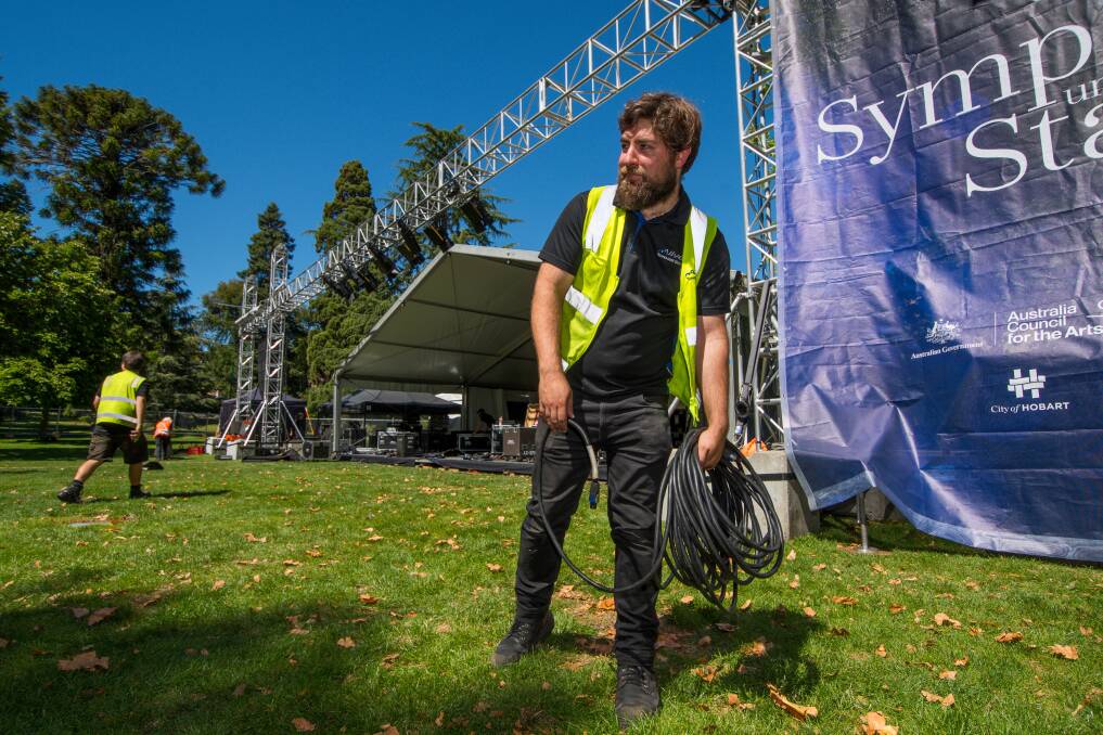 PREPERATIONS UNDERWAY: Alive Technologies head of audio Bob Gardam setting up for the Launceston Symphony Under the Stars in City Park. Picture: Scott Gelston