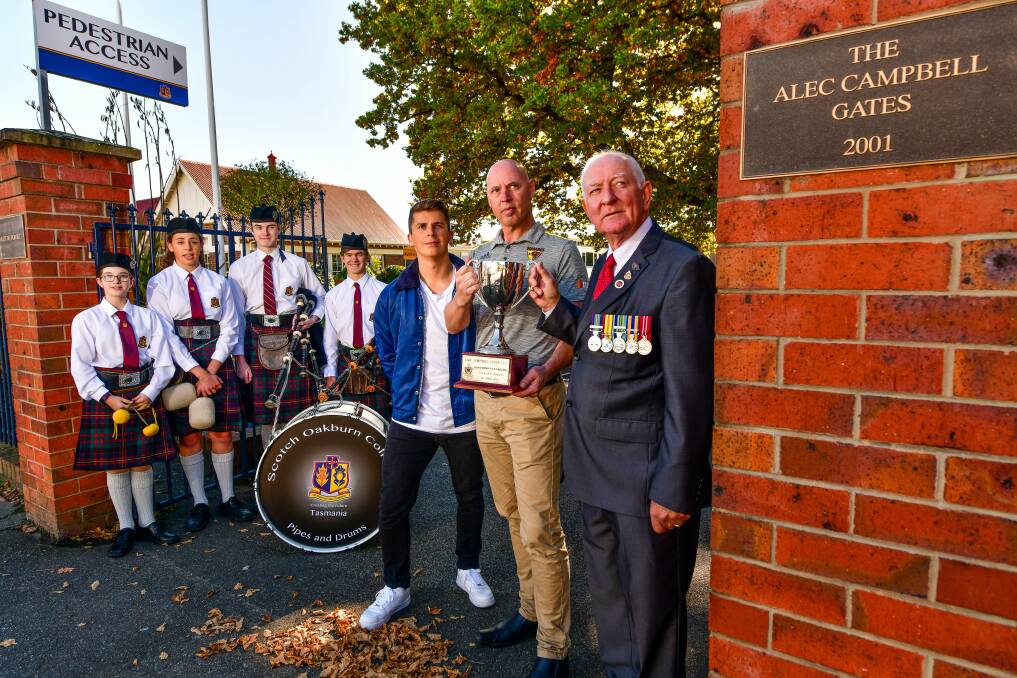 Soctch Oakburn College Pipes and Drums members Violet Haysom, Charlotte Bell, Kael Haysom, and Lachlan Stewart, musician Reuben Koops, Hawthorn's David Cox and RSL Tasmania acting president Geoff Leitch. Picture: Scott Gelston