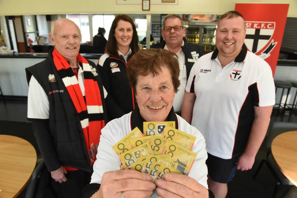 GOOD CAUSE: Launceston Saints Supporter Group treasurer Bev Caitlin with Roy Reid, secretary Ree Smith, president Robert Anderson, and Patrick Cripps at the Invermay Bowls Club. Picture: Paul Scambler