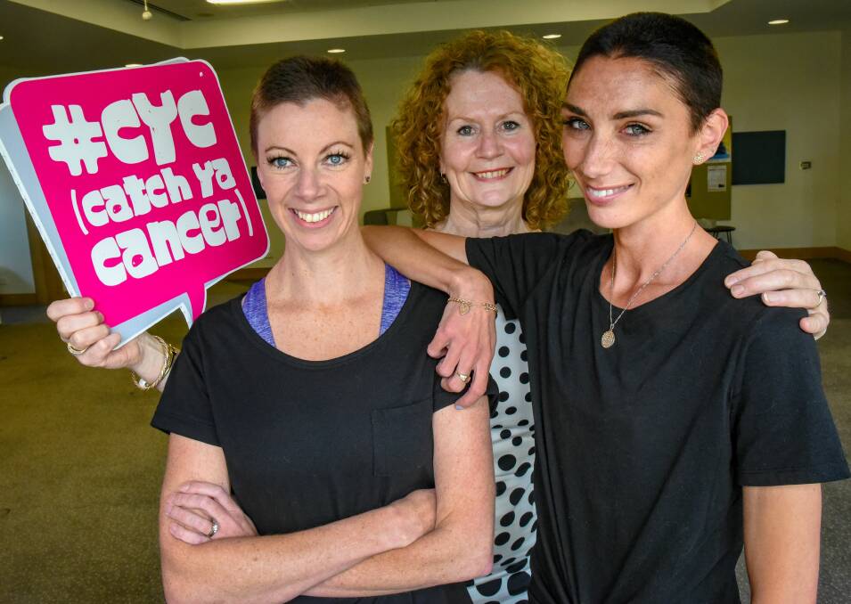DYNAMIC DUO: Megan Martin and Alex Clear, with Cancer Council Tasmania chief executive Penny Egan. Picture: Paul Scambler