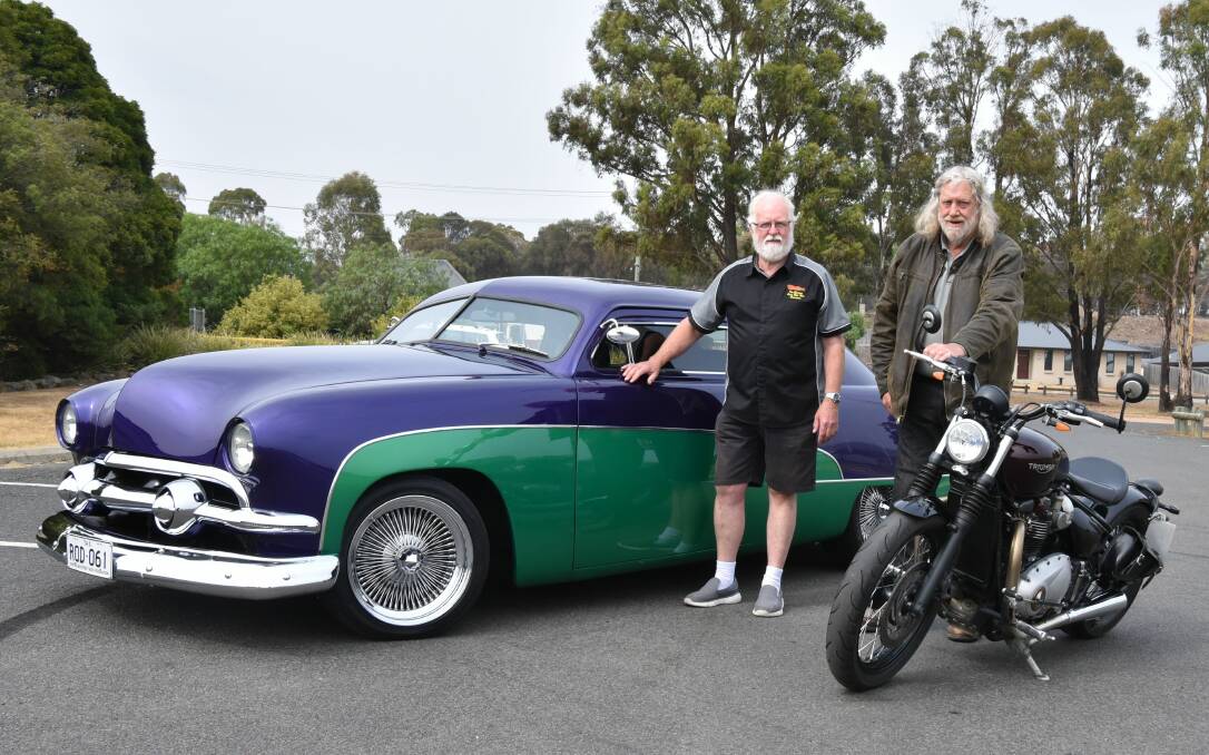 MUSCLE: Van Diemens Street Rod Club's Grant Sutton and Al Hutton with the green and purple 1951 Ford Custom. Picture: Neil Richardson