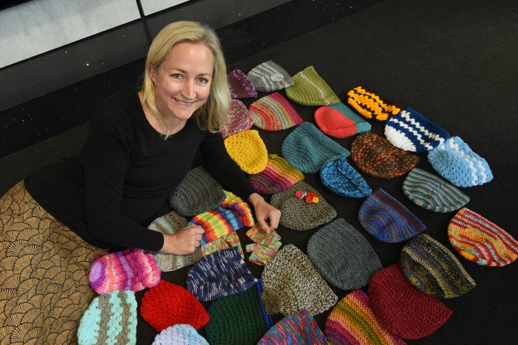 GOALS: Launceston's Skye Brean with some of the beanies made for her project to make 1000 beanies to donate to people in need this winter. Picture: Paul Scambler.