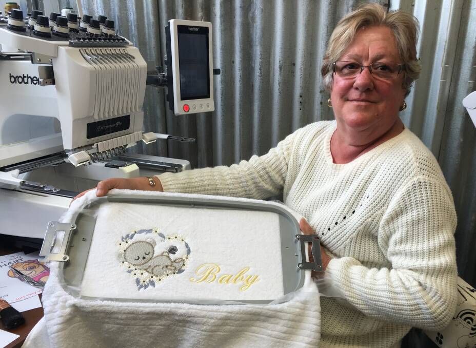 A STITCH IN TIME: Anne Johnson shows one of her works made in her embroidery room. Pictures: Doug Dingwall.