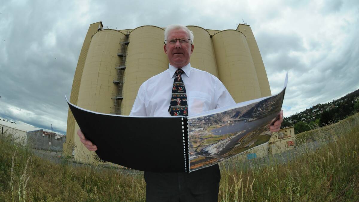 Errol Stewart with plans of the proposed development