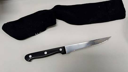 A photo of a knife next to a sock - it was found in hospital.
