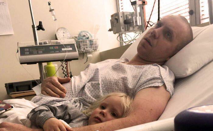 Injured firefighter Rob Boost and his daughter.