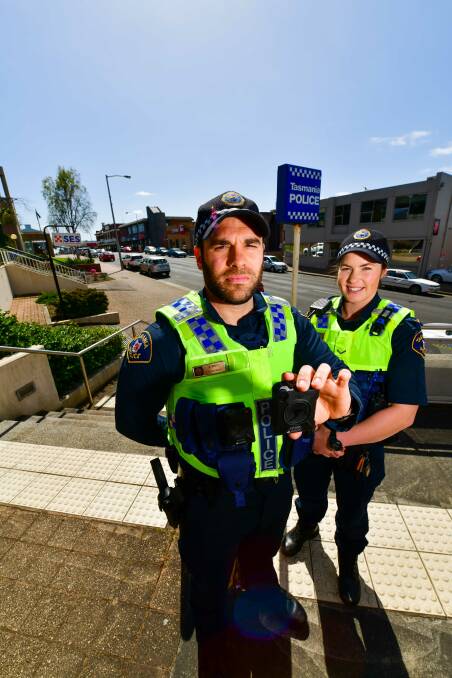 CLEAN UP: Burnie Constables Lee Bailey and and Annika Coles with new body mounted cameras. Picture: Scott Gelston.

