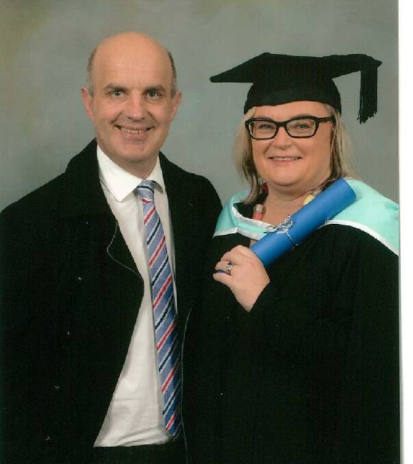 MASTERS: Ms Cehtel with husband Simon Ward after graduating with her masters degree in 2016.
