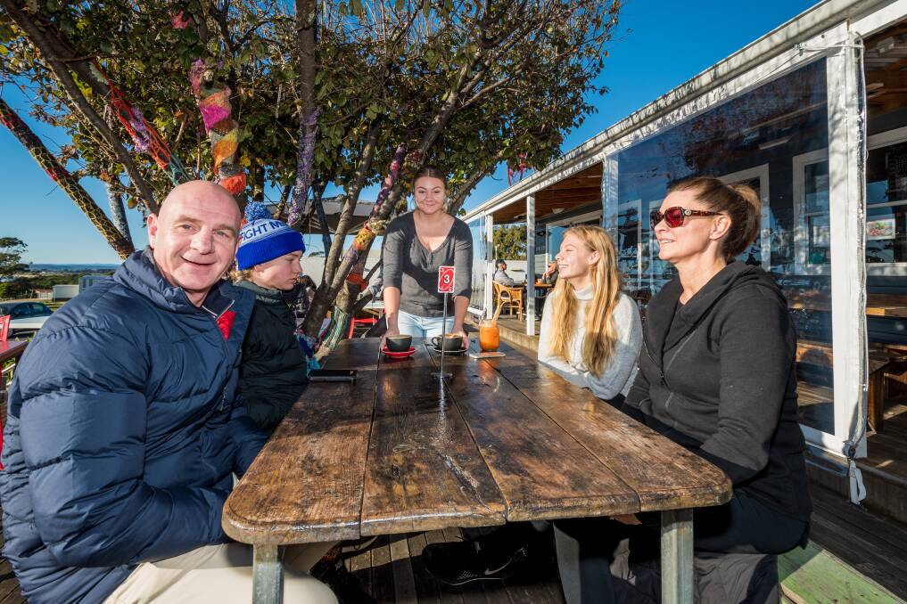 COFFEE BREAK: Bridport Cafe waitress Nichola Hole serves Premier Peter Gutwein and his wife Mandy and children Finn and Millie. Picture: Phillip Biggs 