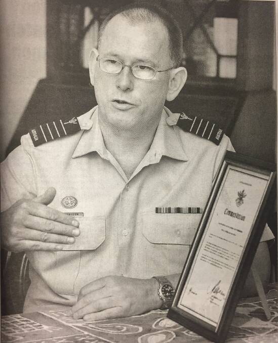 HUMBLE: Dr George Merridew in 2004 modestly accepting a citation for his role in helping victims of the Bali bombing.