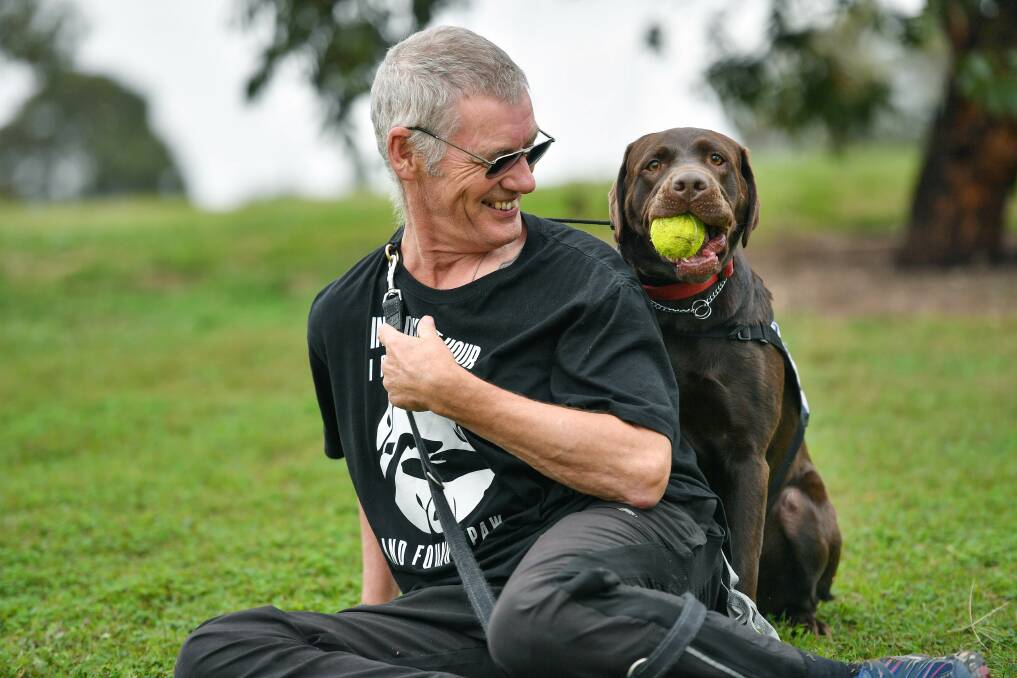 Ron Fenton with his trauma dog, Yogi. Photo: Joe Armao