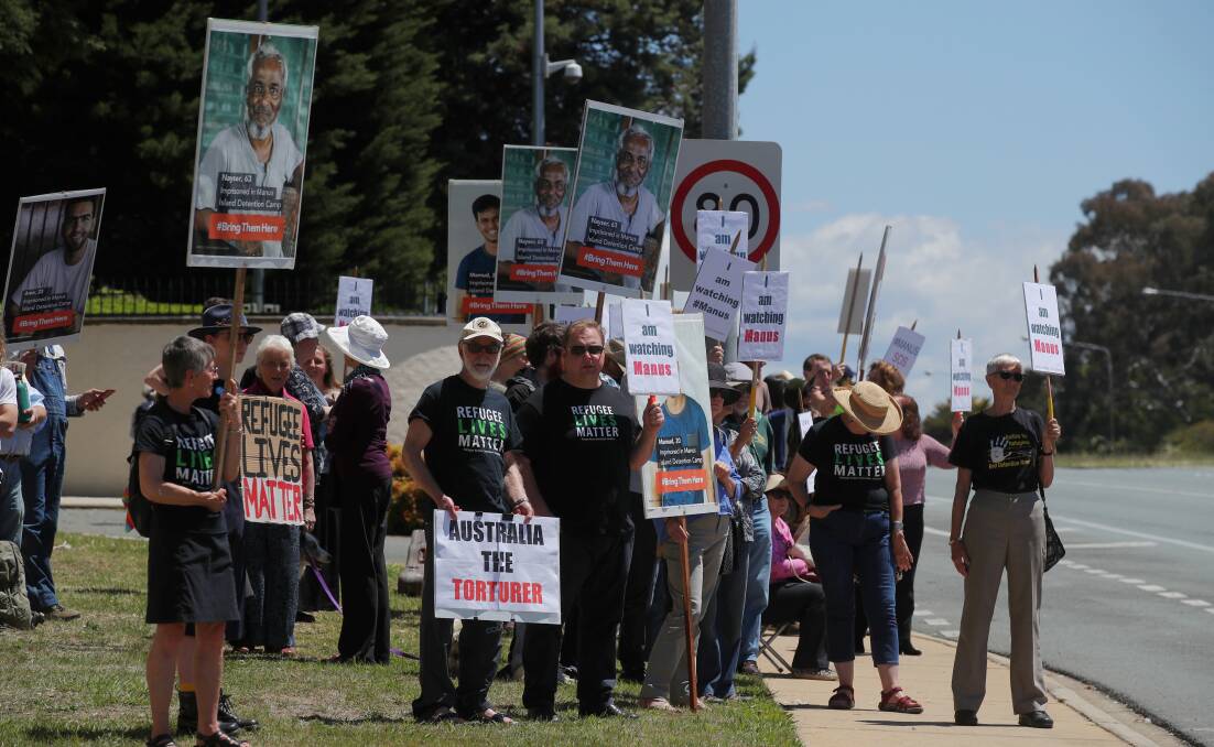 TAKING A STAND: Protestors gather outside The Lodge in support of men detained on Manus Island. Picture: Fairfax