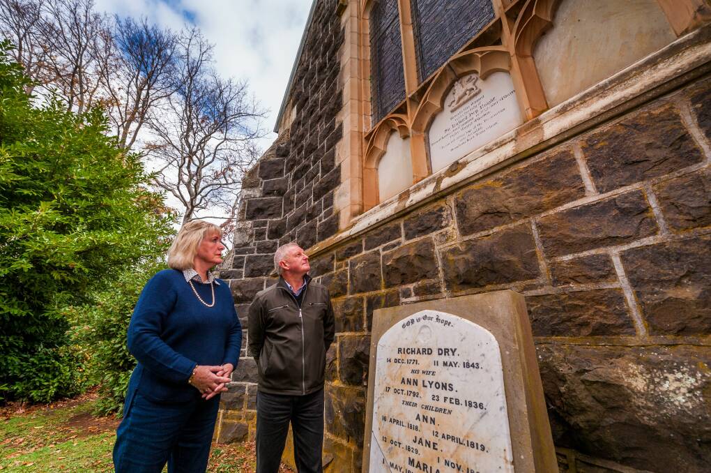 Rest in peace: Kerry and Vicki Wood, of Carrick, at the gravestone of Sir Richard Dry. Picture: Phillip Biggs