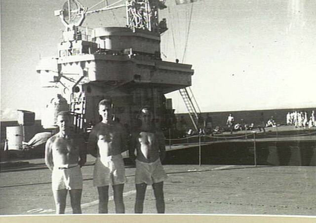 Australian Prisoners of War leaving Japan aboard HMS Speaker. These three men are of the 2/40th or the 2/21st Battalion. Picture: Australian War Memorial/045149