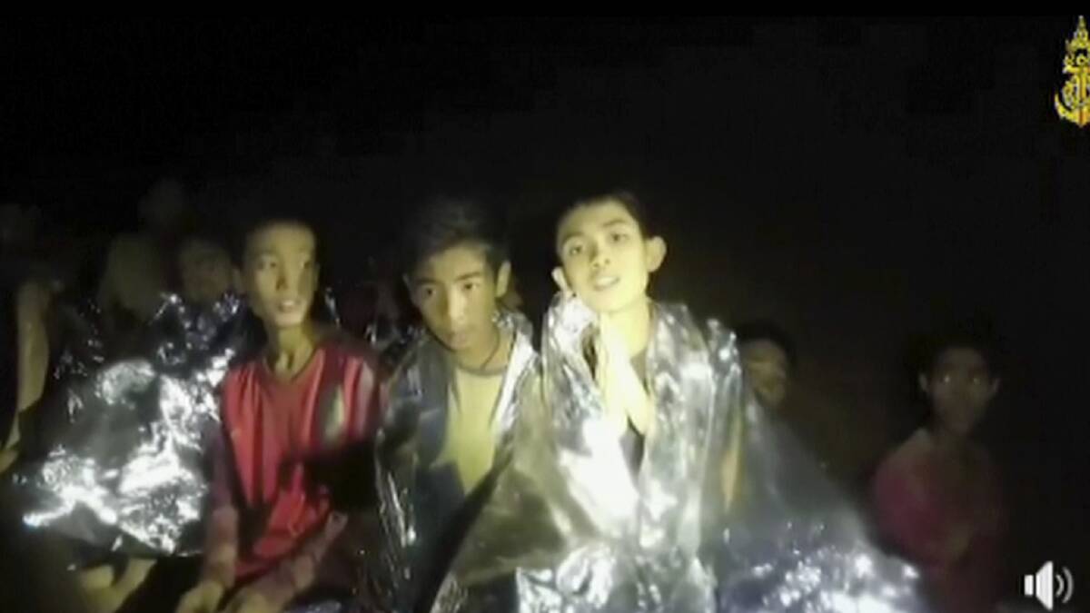 In this July 3, 2018, image taken from video provided by the Thai Navy Seal, Thai boys are with Navy SEALs inside the cave, Mae Sai, northern Thailand. Picture: Thai Navy Seal/AP