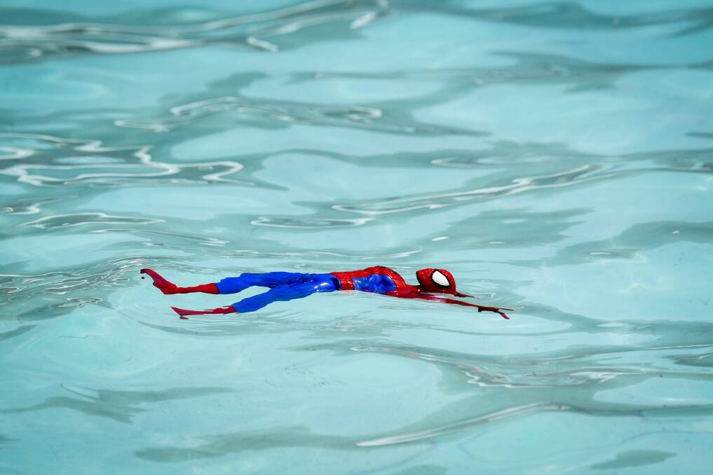 COOL ACTION: Spider-man cooling down in the pool at the Gorge. Picture: Paul Scambler