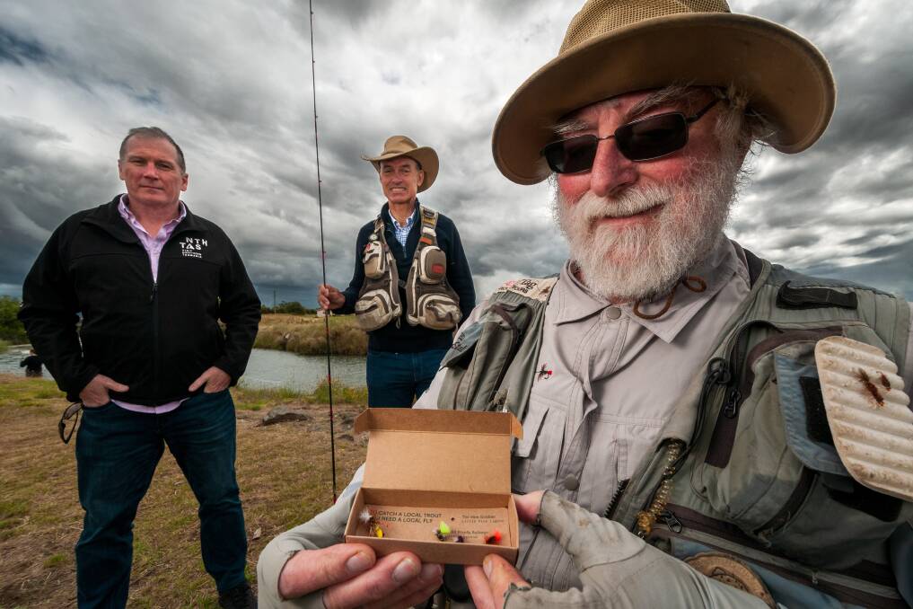 Chris Griffin with Water Minister Guy Barnett and Trout Guides and Lodgers Tasmania Association president Roger Butler on Sunday. Picture: Phillip Biggs