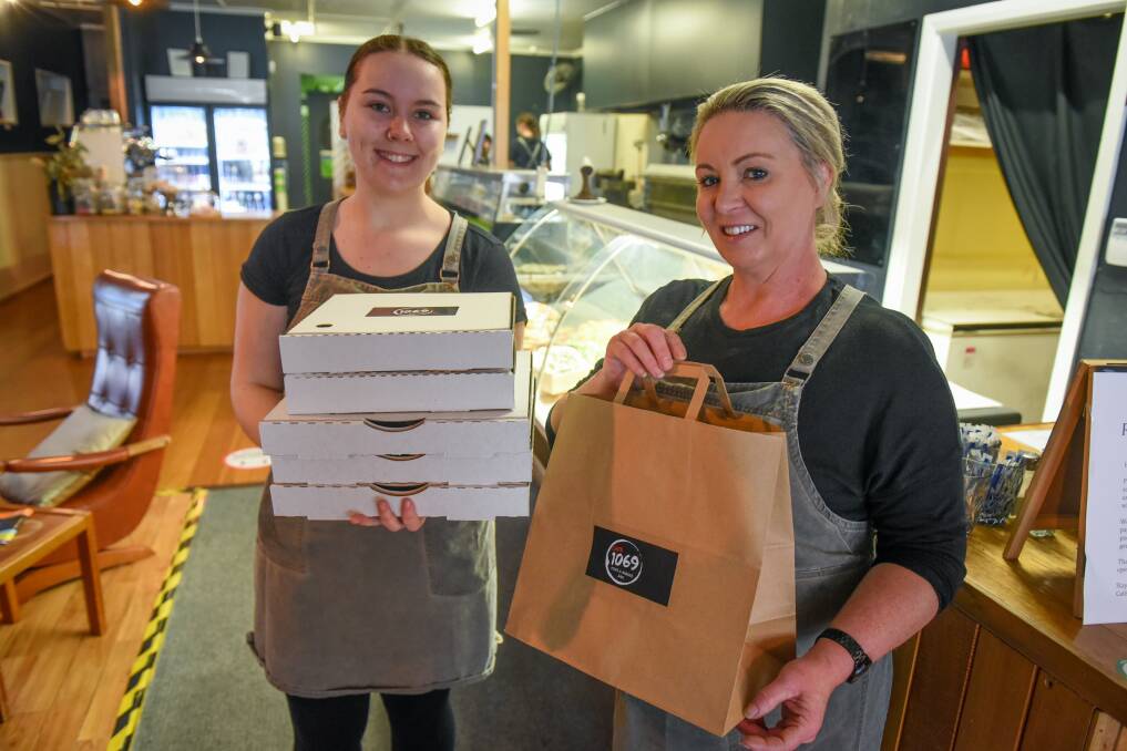 The flow-on effects from TEMCO into the town of George Town include providing trade for local cafes, such as Cafe 1069, where Makeila Lyons and Lica Blair work. Picture: Paul Scambler