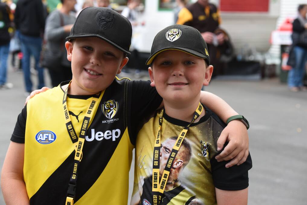 Levi and Archie Allan of Devonport get ready to watch the match. Picture: Paul Scambler