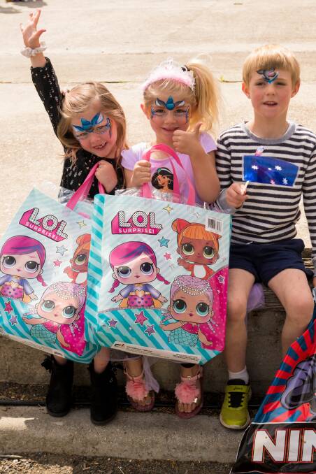 Tillie Pendergast, Nicola McNeil and Riley McNeil with their showbags at the Royal Launceston Show. Picture: Phillip Biggs