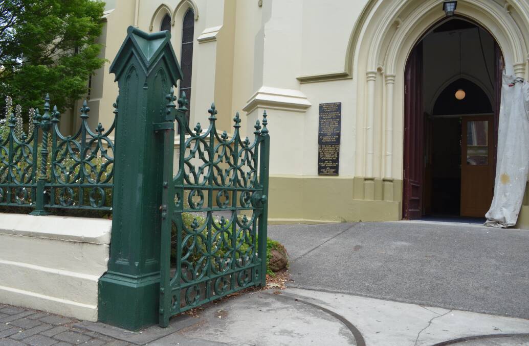 The heavy colonial iron gates are the oldest surviving in Australia.