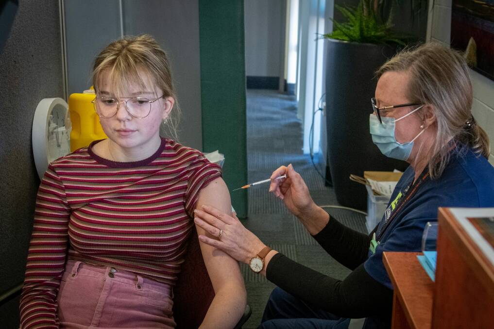 Bella Larby, 18, of Beaumaris, gets her vaccination from clinical nurse consultant Tamya Panitzki at the vaccination schools program at Launceston College. Picture: Paul Scambler