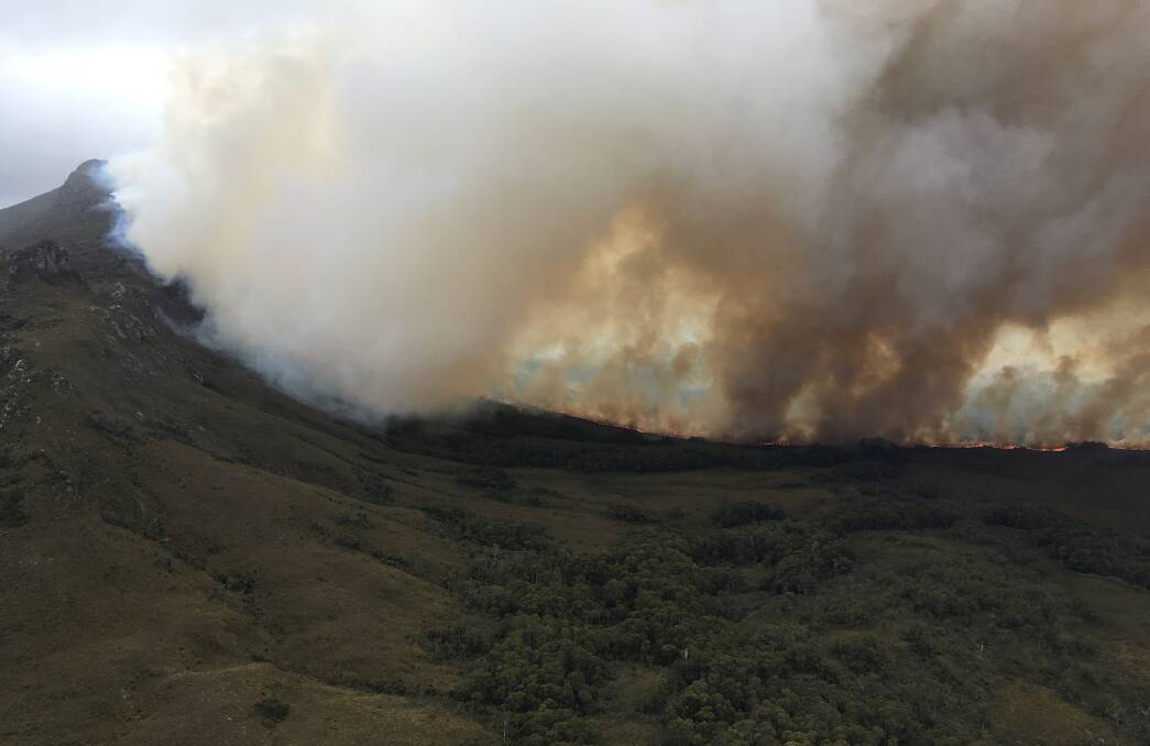 Dry lightning ignited dozens of fires in the Tasmanian wilderness in December. Picture: NSW RFS