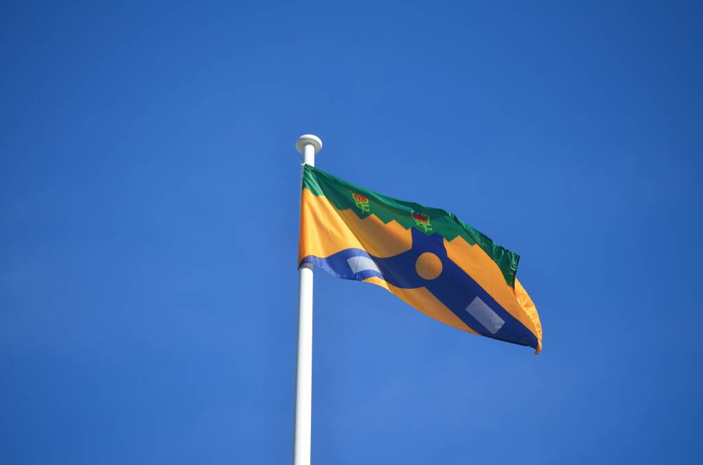 The flag of Launceston is based on the city's Coat of Arms of 1957, depicting the North and South Esk rivers, kanamaluka/Tamar, tin ingots and Waratah flowers. Picture: Adam Holmes