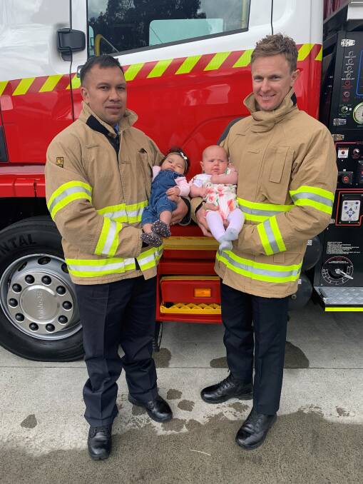 New TFS firefighters Watene Kuka with his daughter Aria, and Joel Marshall with his daughter Sonny. Both babies were welcomed into the world while their fathers completed the TFS training course. Picture: Supplied