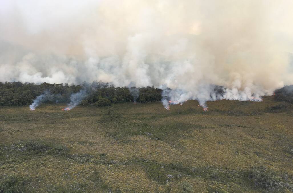The fire no longer poses a risk to the community, but is likely to continue burning for weeks until a significant rainfall event arrives. Image: NSW RFS