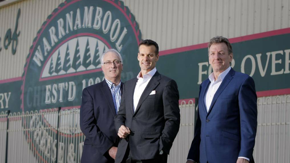 Warrnambool Cheese and Butter chairman Terry Richardson and CEO David Lord with Lino Saputo in 2013, when WCB backed the takeover offer. Picture: The Standard