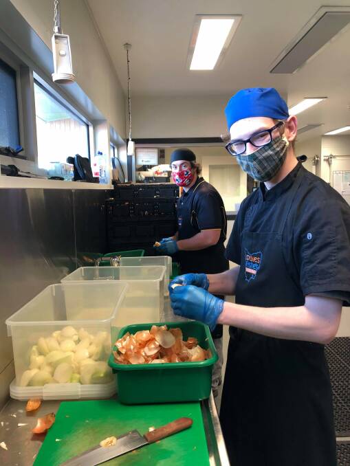 Loaves and Fishes volunteers prepare the food deemed excess by supermarkets and producers, to be distributed to Tasmanian charities. Picture: supplied
