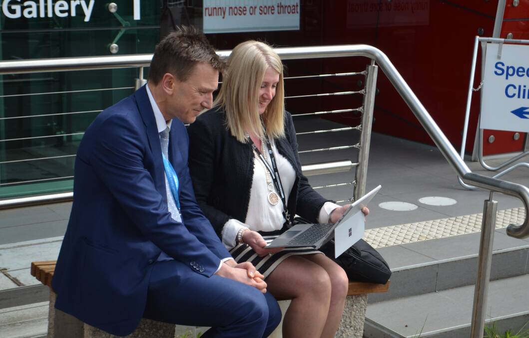 LGH neurologist Dr Matt Lee-Archer and Northern telehealth coordinator Kate Prince carry out a session with a patient online on Friday. Picture: Adam Holmes