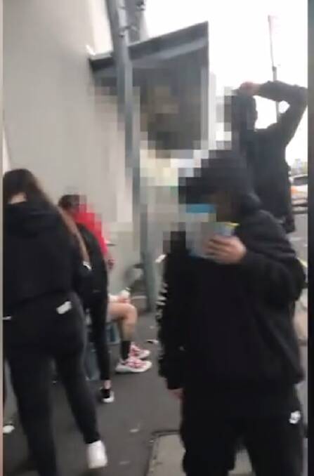 A still from the video posted on Facebook, in which a group of teenagers abuse and intimidate a Vietnamese university student in Mowbray.