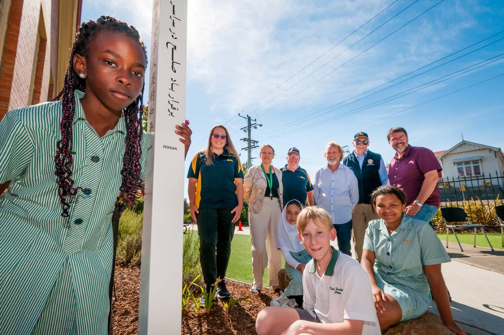 East Launceston Primary School students, staff and Rotary Club of Central Launceston representatives with the school's Peace Pole. Picture: Phillip Biggs