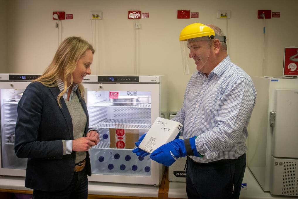 Health Minister Sarah Courtney tours the COVID vaccination clinic at the Launceston General Hospital with LGH pharmacy manager Liam Carter. Picture: Paul Scambler