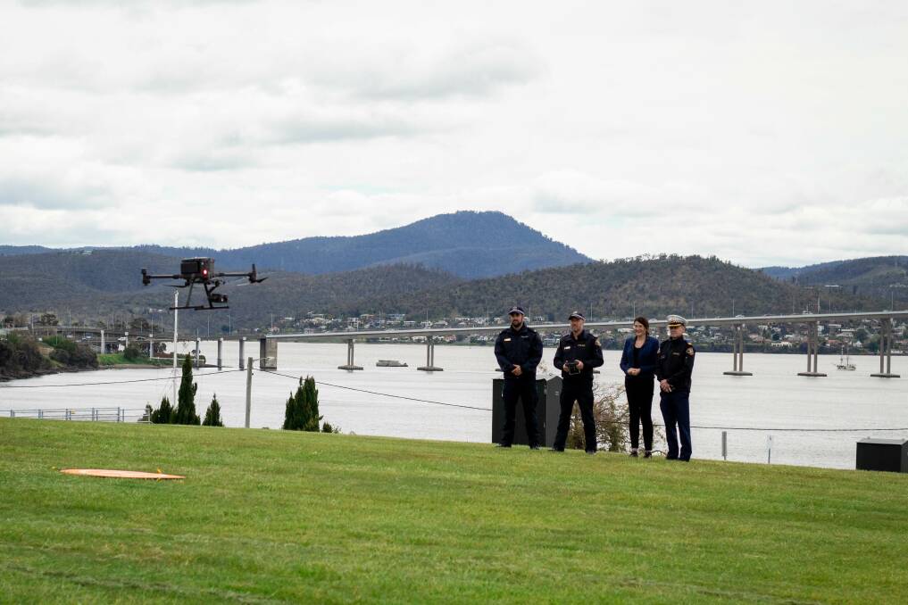Officers demonstrate a $30,000 police drone in Hobart on Monday. Their use is increasing quickly as technology improves. Picture: supplied