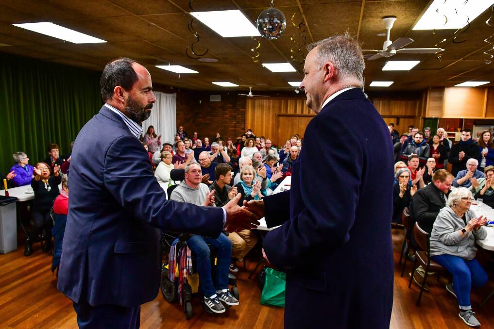 Ross Hart and Anthony Albanese shake hands at the function in Ravenswood. Picture: Scott Gelston