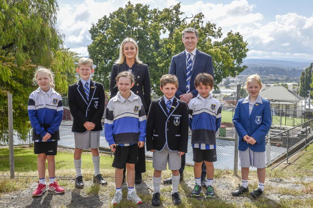 Launceston Church Grammar acting head of campus Jess Kernan with headmaster Richard Ford and students Stella Mills, Ben Watson, Emily Fanning, Archie Green, Henry Thomas and Imogen Wadley on the land. Picture: Craig George