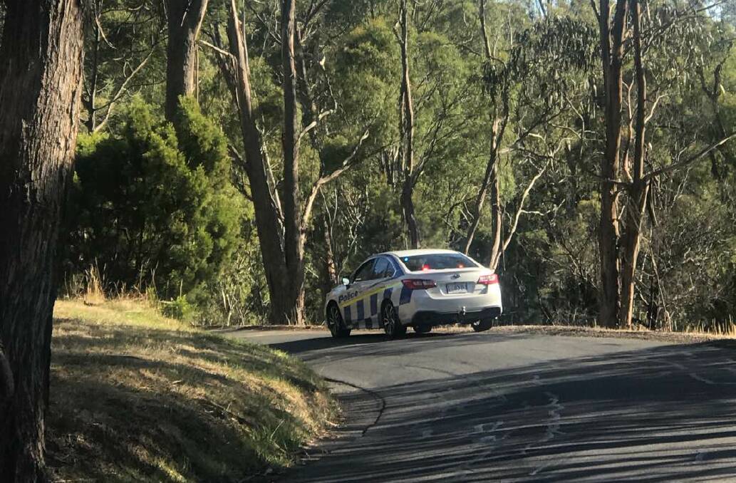 Police on the scene of the crash near the entrance to Punchbowl Reserve.