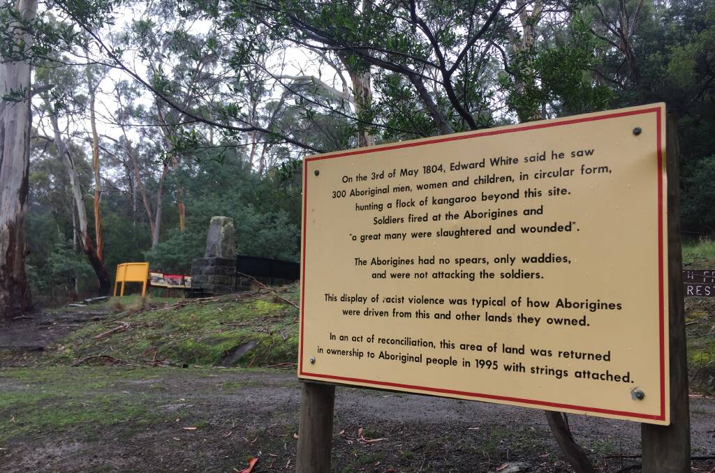 The Aboriginal community has placed this sign near the Bowen monument, which can be seen in the background, explaining the historical context of the site. Picture: Adam Holmes